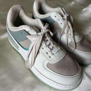 White and Gray Sneakers with Green Accents